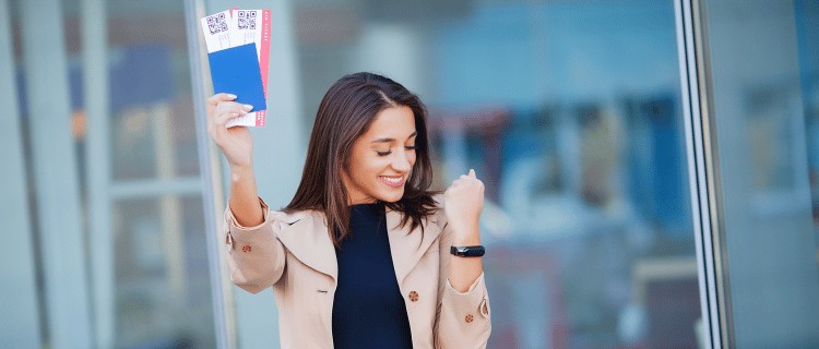 air ticket in a hand of woman